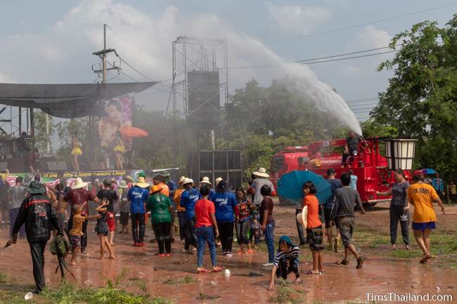 fire truck spraying water on crowd at mo lam concert