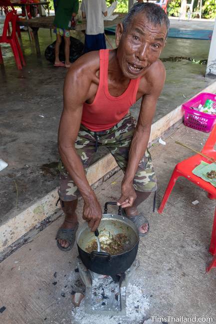 man cooking laap