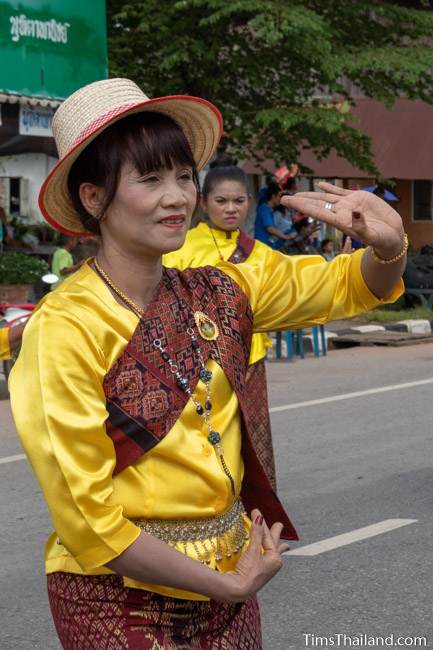 woman in Thai traditional clothes dancing in the parade