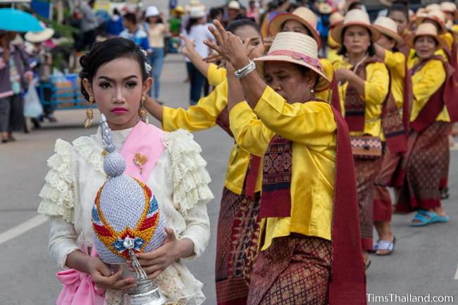 women in Thai traditional clothes dancing in the parade