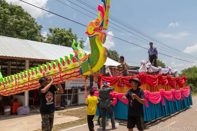 putting fake rocket on a parade float