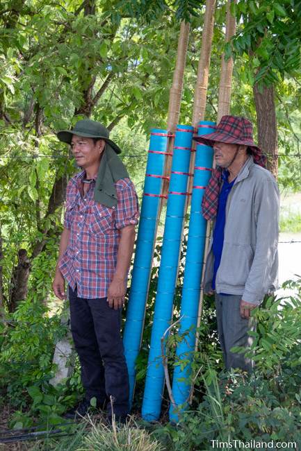 men standing next to rockets