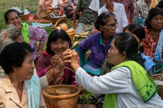 women looking at a chicken bone