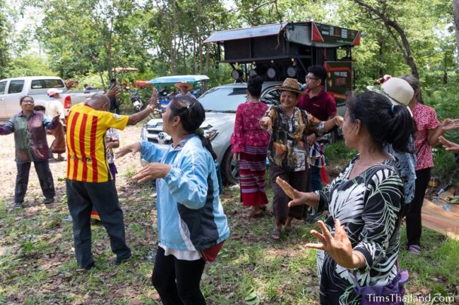 people dancing in front of truck with large PA system