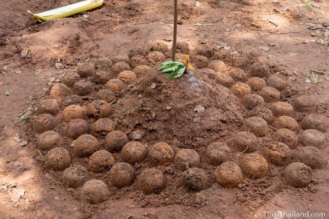 small stupa made of dirt