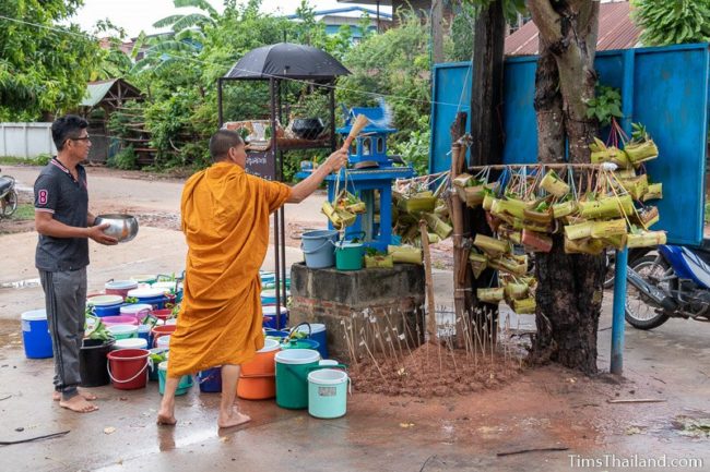 monk splashing water