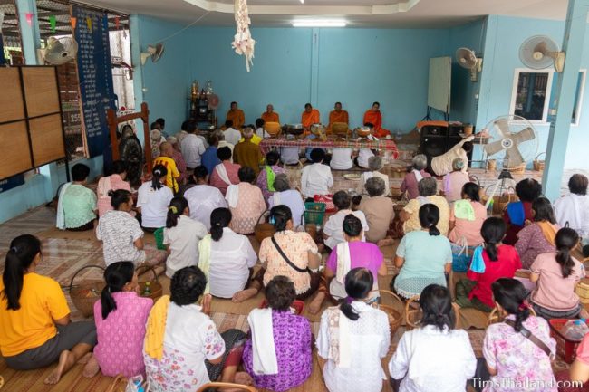 people sitting in front of monks