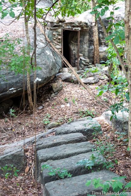 sandstone blocks in quarry in front of cave