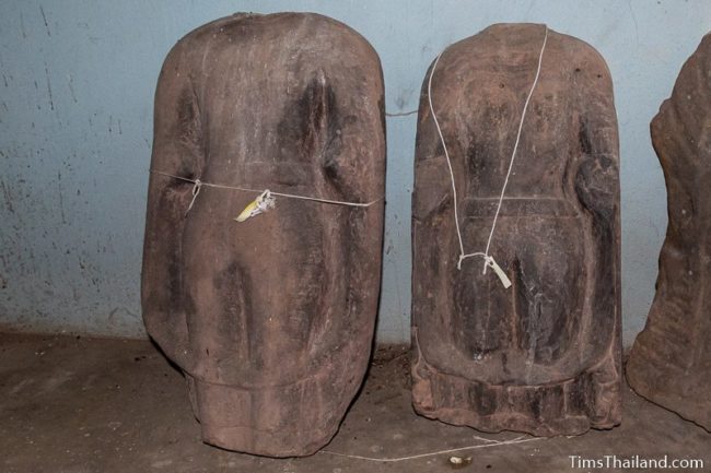 damaged Khmer Buddha statues