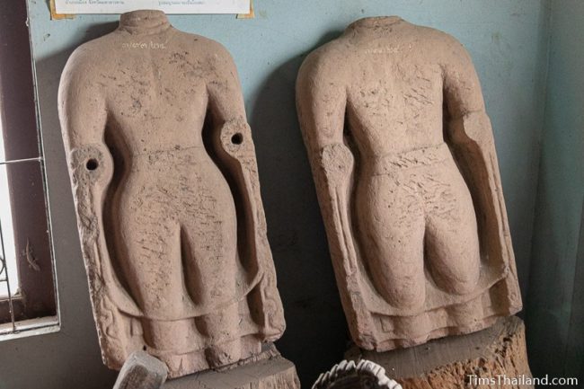 damaged Khmer Buddha statues