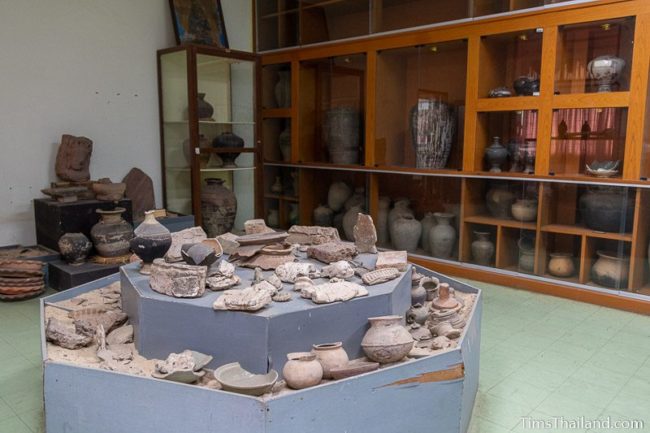 room full of pottery and fragments of stone carvings