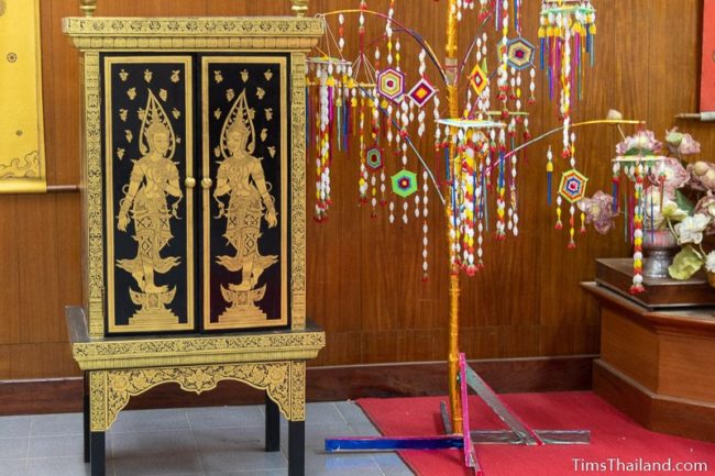 gold-painted cabinet for storing palm leaf manuscripts