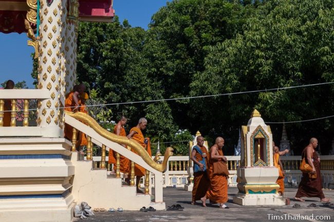 monks walking out of the ubosot