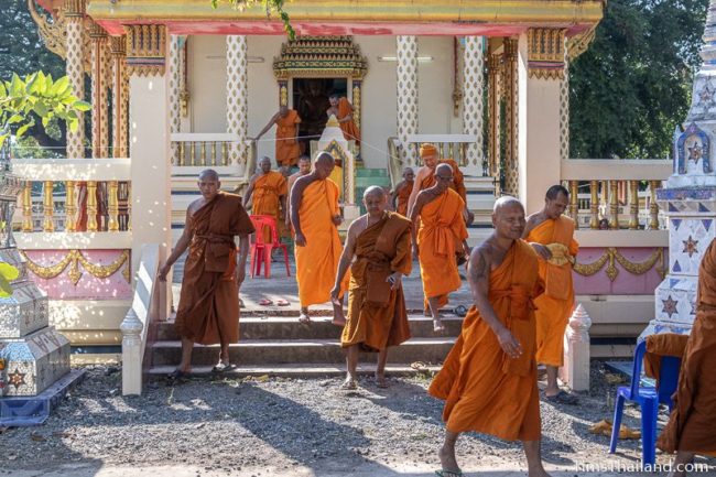 monks walking out of the ubosot