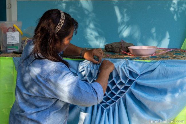 woman folding clothing decoration