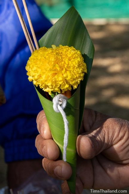 packet of string, flower, candles, and incense