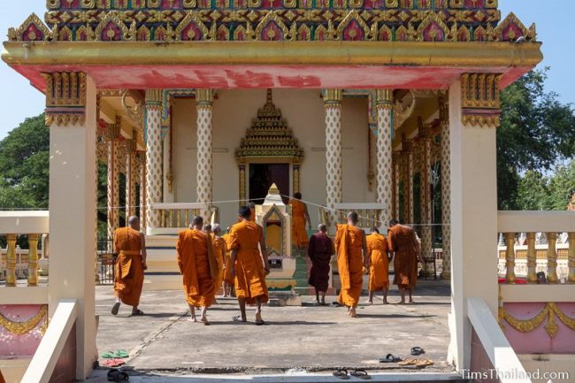monks walking into the ubosot