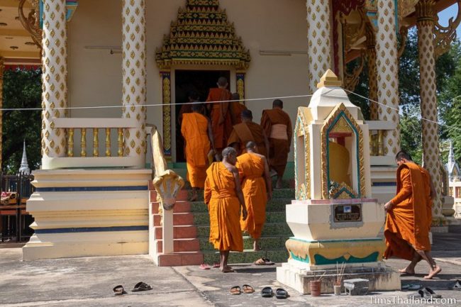 monks walking into the ubosot