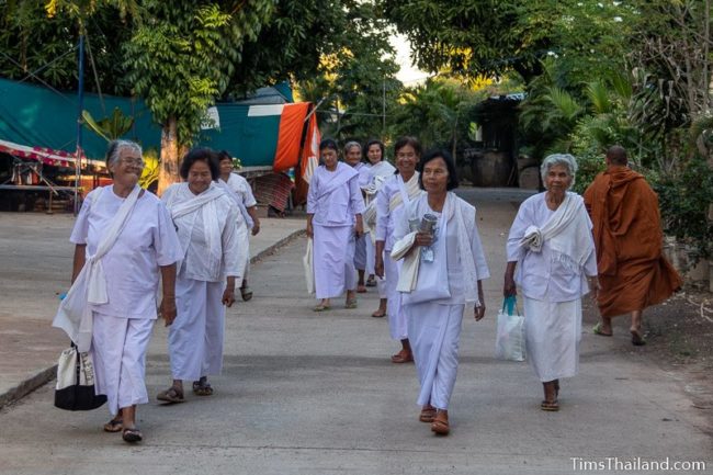 group of women in white walking