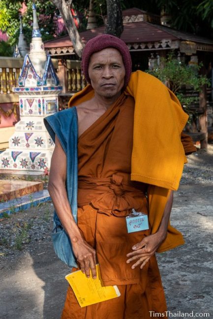 monk holding chanting book