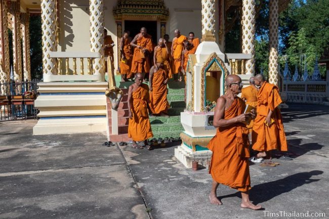 monks walking out of the ubosot