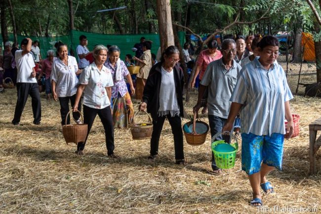 people carrying food baskets