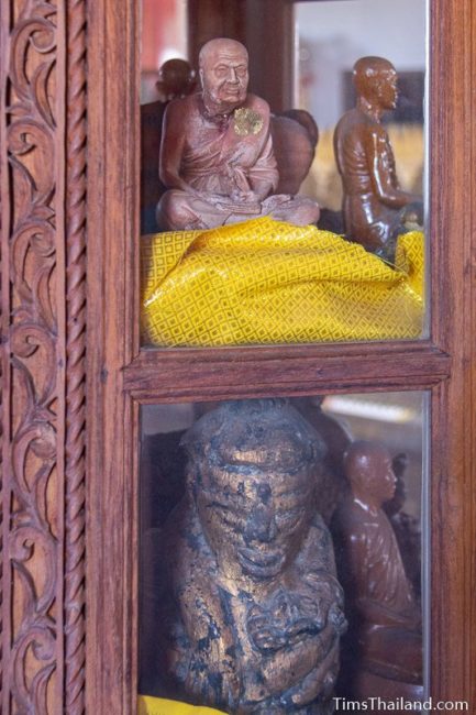 monk statues in a case