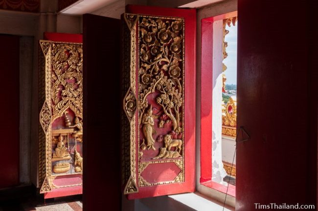 carved wood doors with Jataka scenes