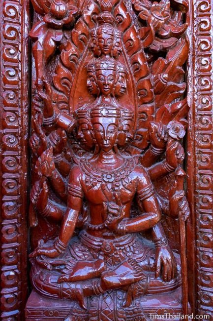 woodcarving of a multi-headed god