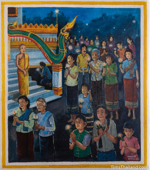 painting of people holding candles and walking around the stupa