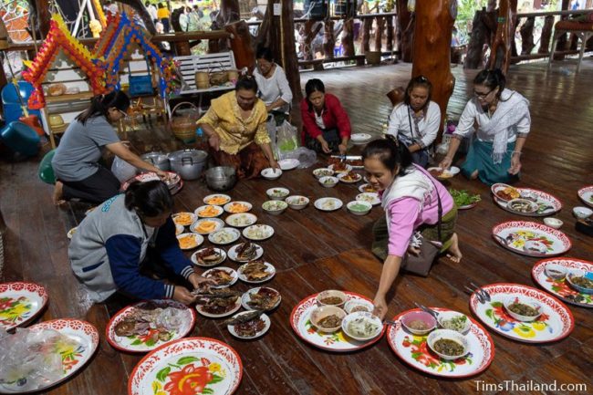women making trays of food