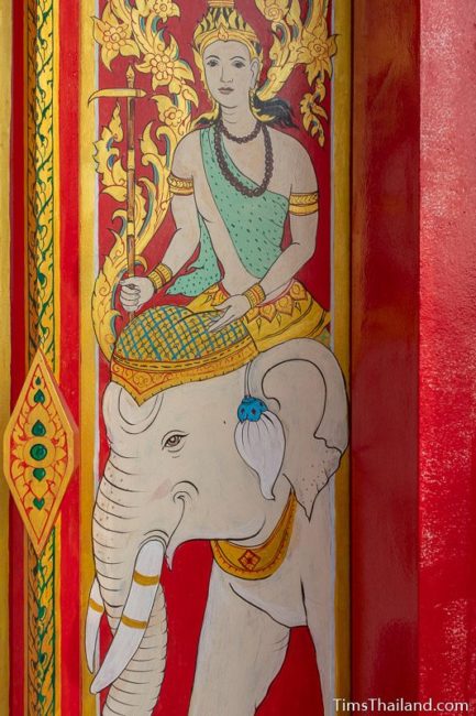 painting of the god Budha riding an elephant