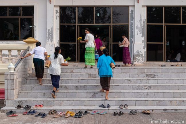 women walking into sala