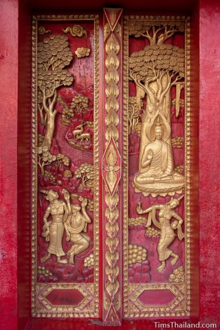 woodcarving of Mara's daughters dancing in front of the Buddha