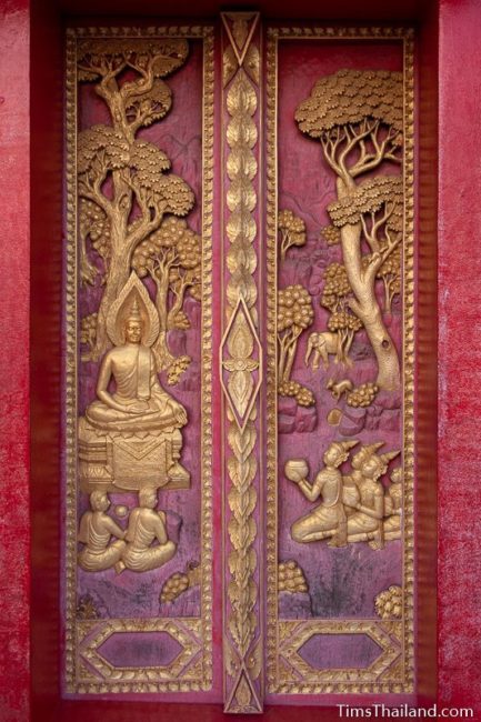 woodcarving of Tapassu, Bhalluka, and gods giving offerings to the Buddha