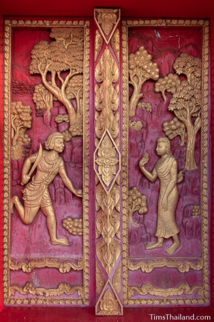 woodcarving of Angulimala running to his mother