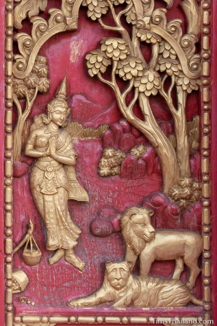 woodcarving of woman with lion and tiger.