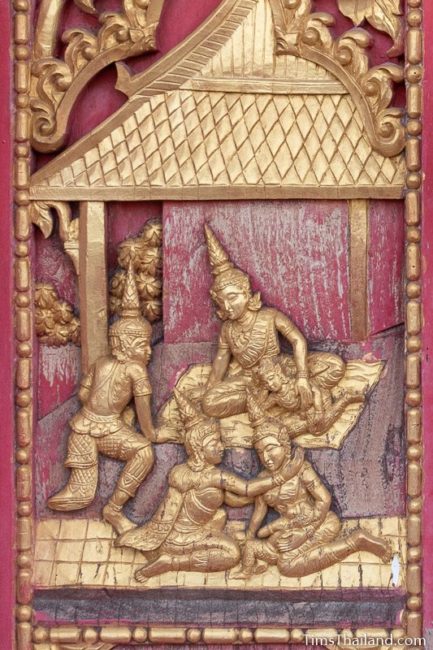 woodcarving of family reunion.