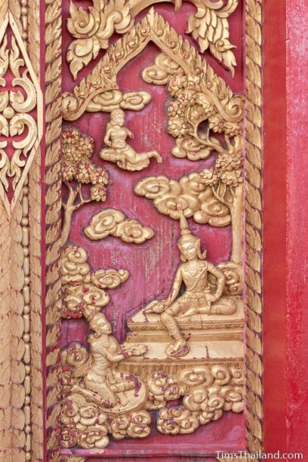 woodcarving of Indra blessing his queen in heaven.