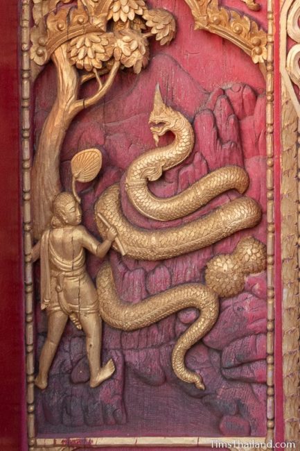 woodcarving of giant naga.