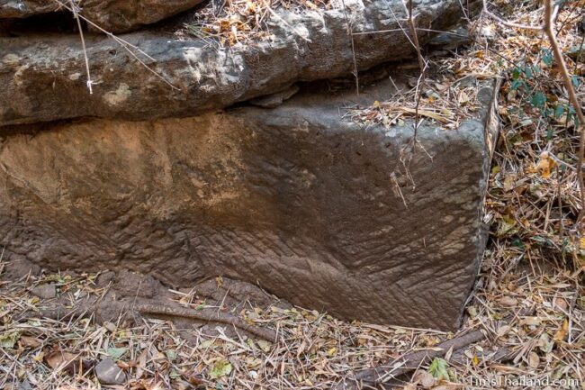 rock wall with cut marks