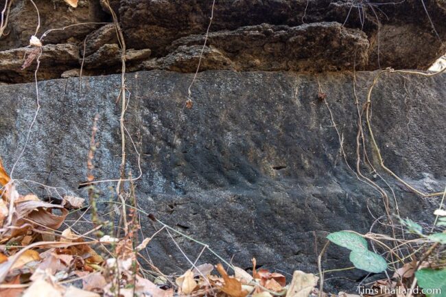 rock wall with cut marks