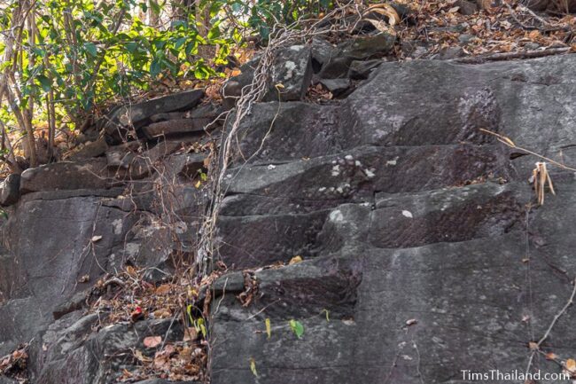 rock wall with cut marks