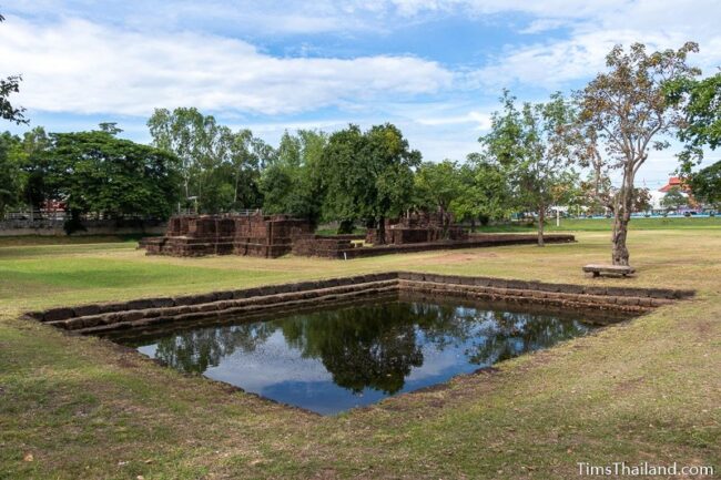 view of temple with sacred pond in the front