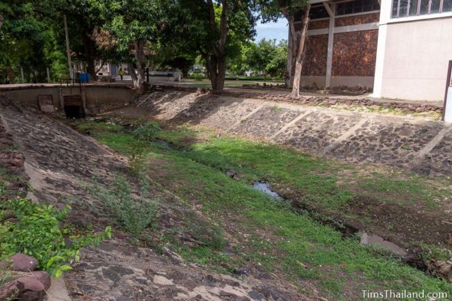 moat alongside Phimai National Museum building