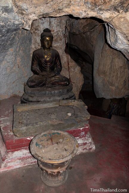 Buddha and Buddha footprint in cave
