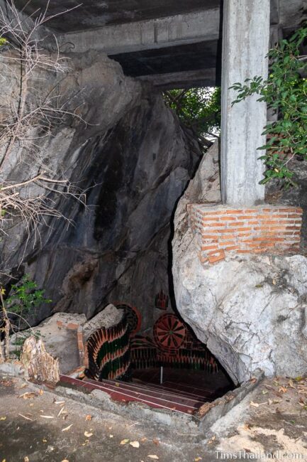 cave entrance with bottle art