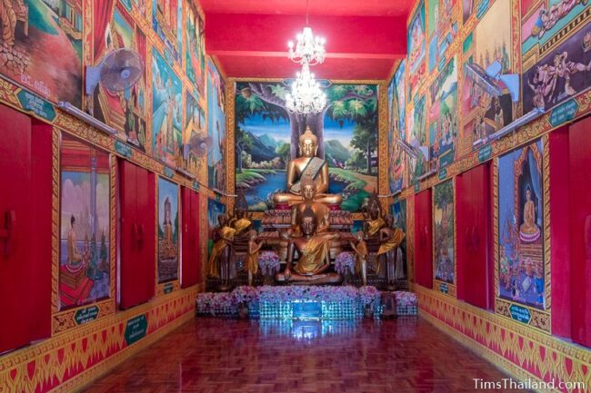 Buddhas and murals inside ubosot