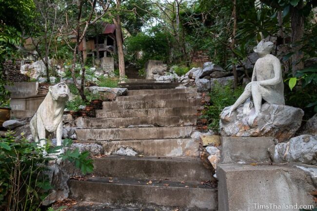 two monkey statues along stairs