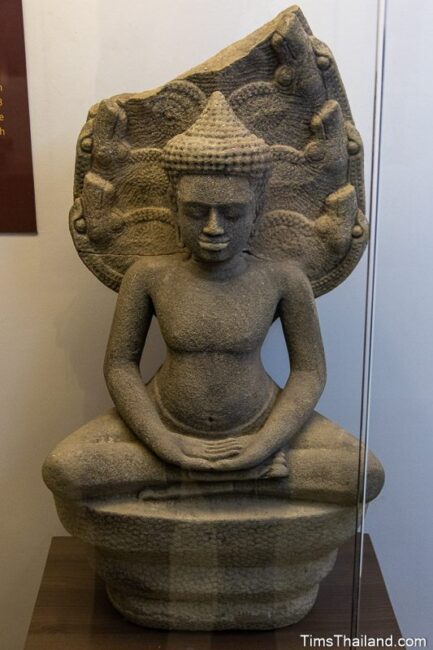 statue of Buddha under a naga